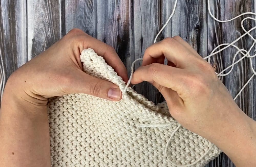 whip stitch the edges of the folded pot holder