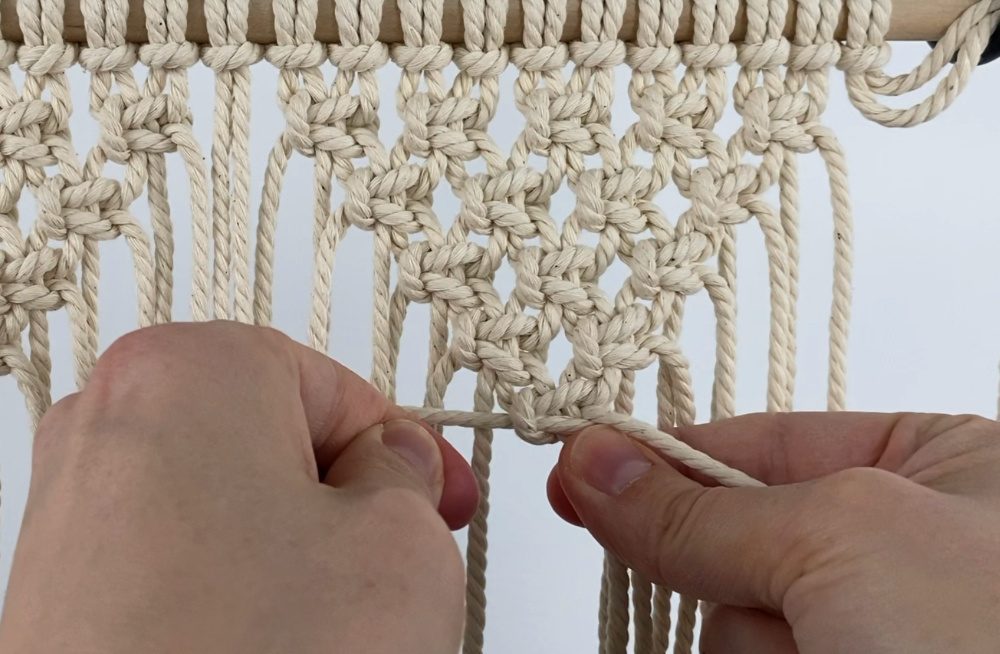 tying alternating square knots in two inverted triangle shapes | small macrame wall hanging