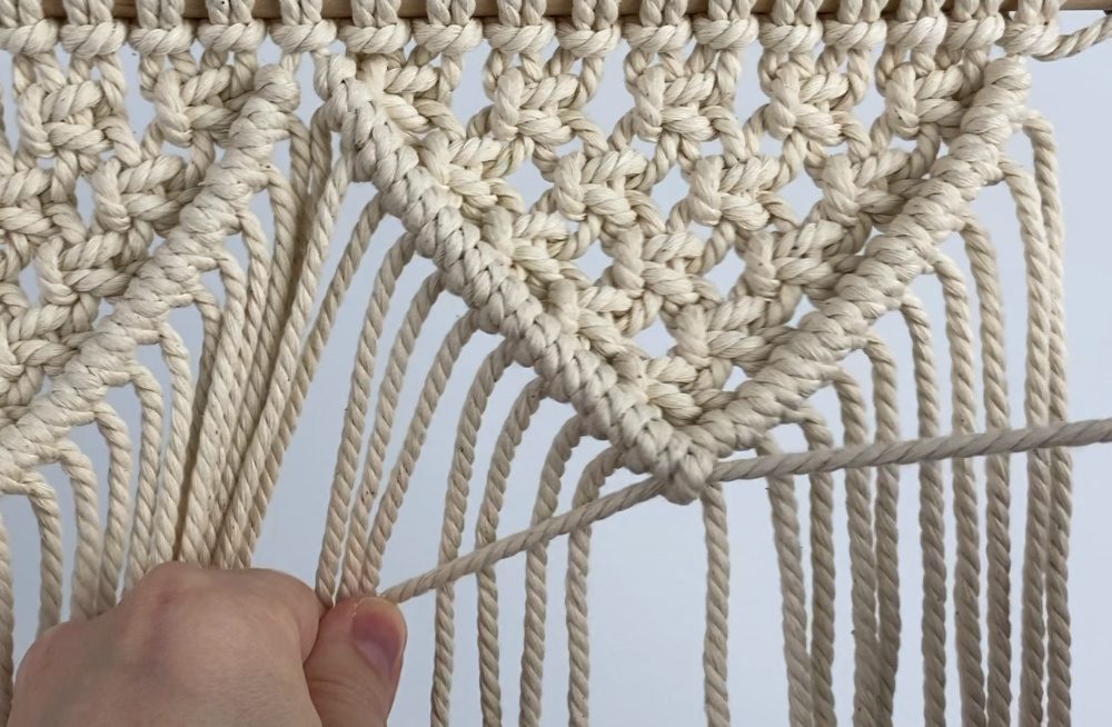 tying diagonal double half hitch knots on the right triangle | small macrame wall hanging