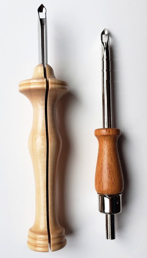 two yarn punch needles side by side on a table