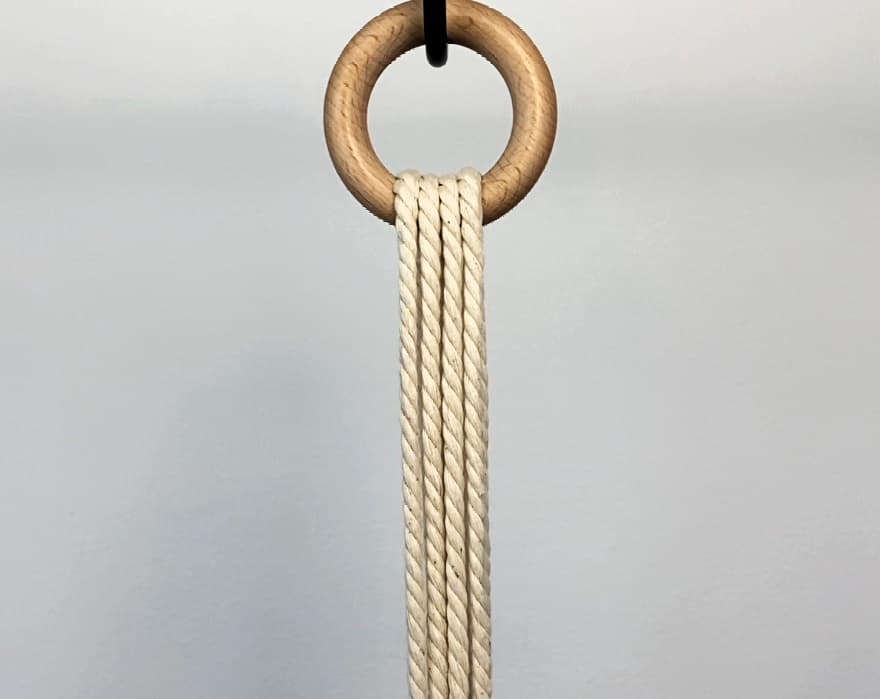 loop working cords through the wooden ring for macrame plant hanger