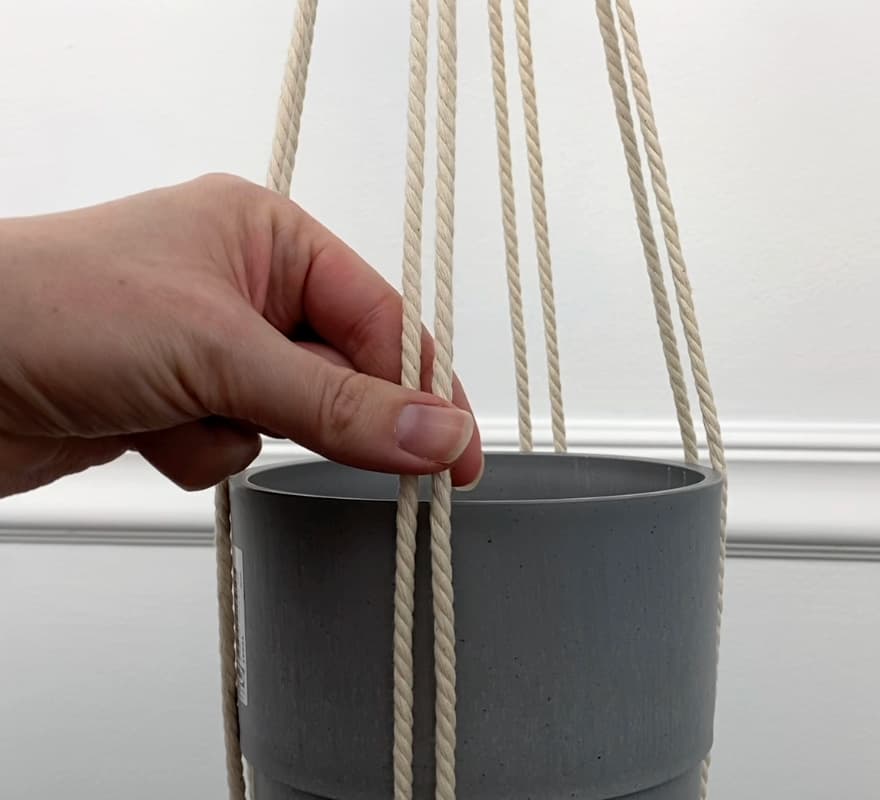 decide where to put the overhand knots to hold your flower pot