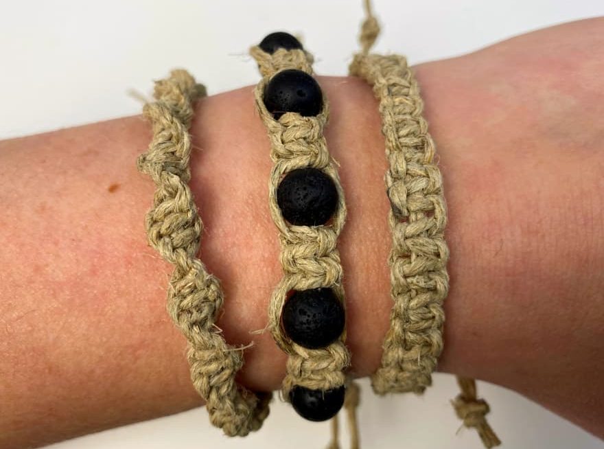 picture of three macrame hemp bracelets on a woman's wrist