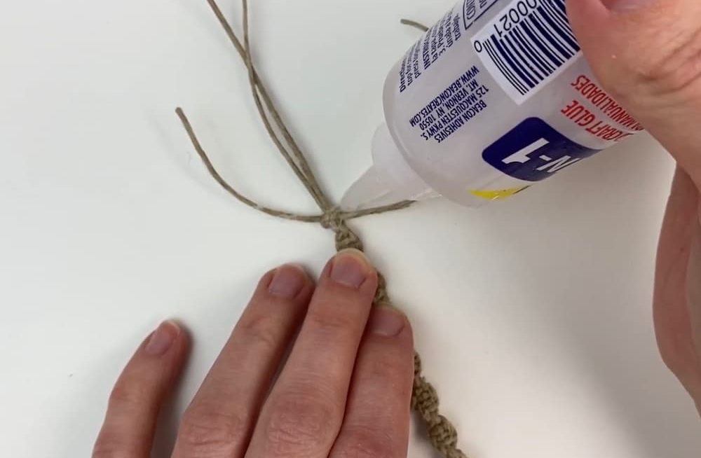 add glue to the knot on spiral macrame bracelet