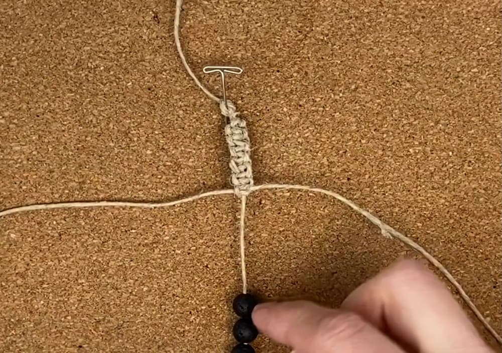 tie six square knots before sliding the beads in place 