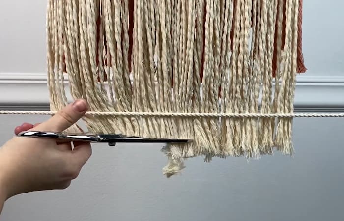 cutting perfectly straight macrame fringe using a guide line