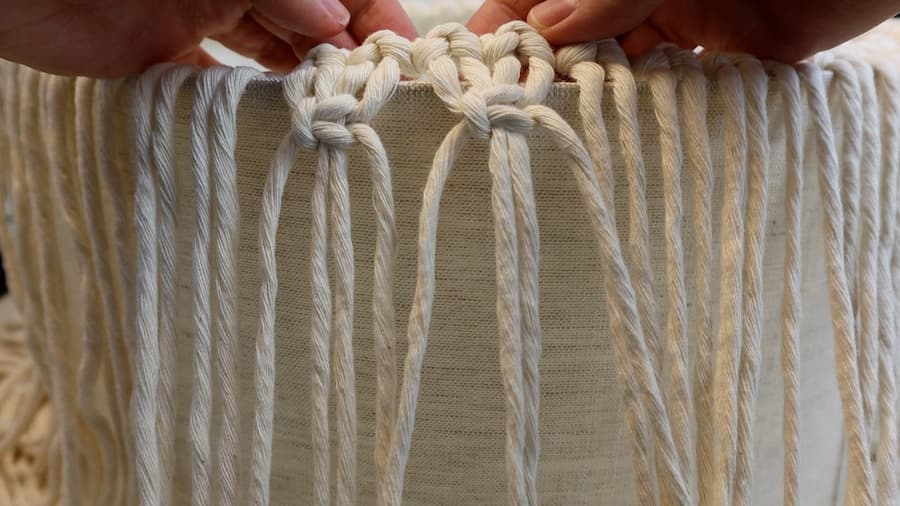 tie the alternating square knots for macrame lamp shade body