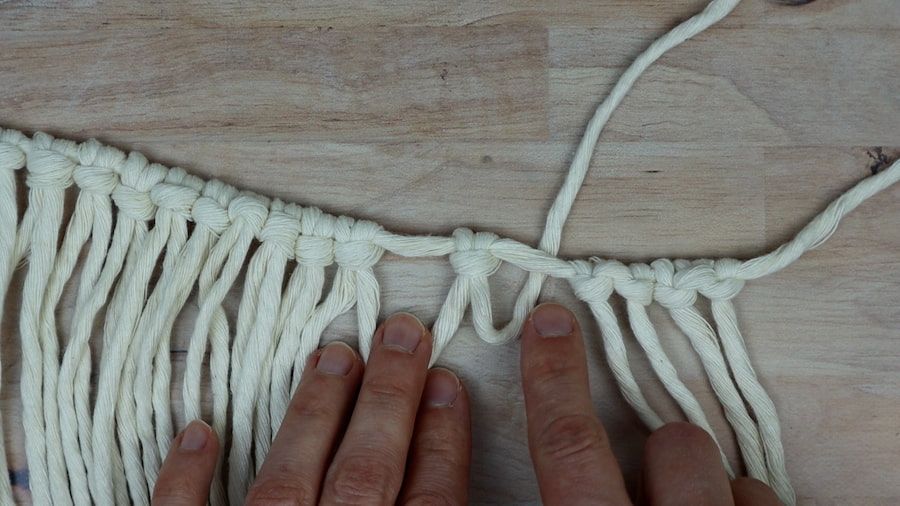 adding an extra hitch to each side of the larks head knots for DIY macrame lamp shade