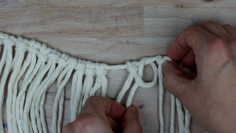 adding an extra hitch to each side of the larks head knots for DIY macrame lamp shade