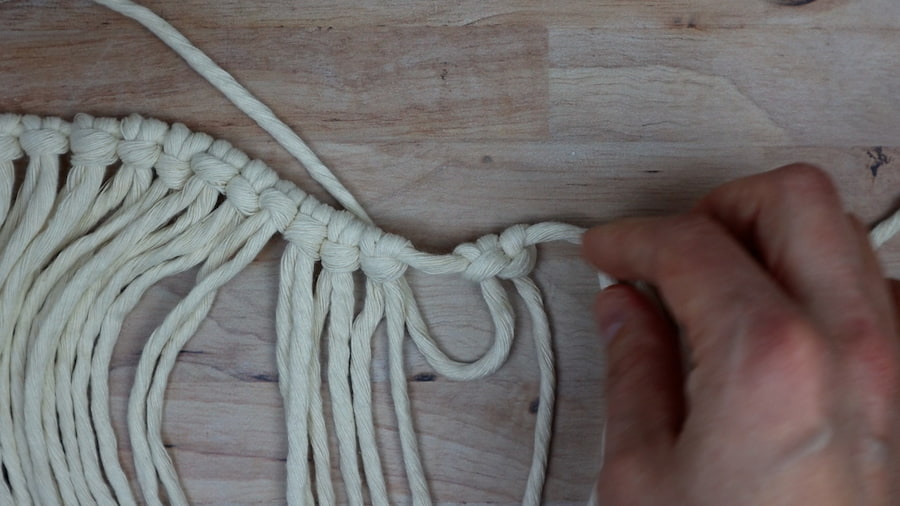adding an extra hitch to each side of the larks head knots for DIY macrame lamp shade