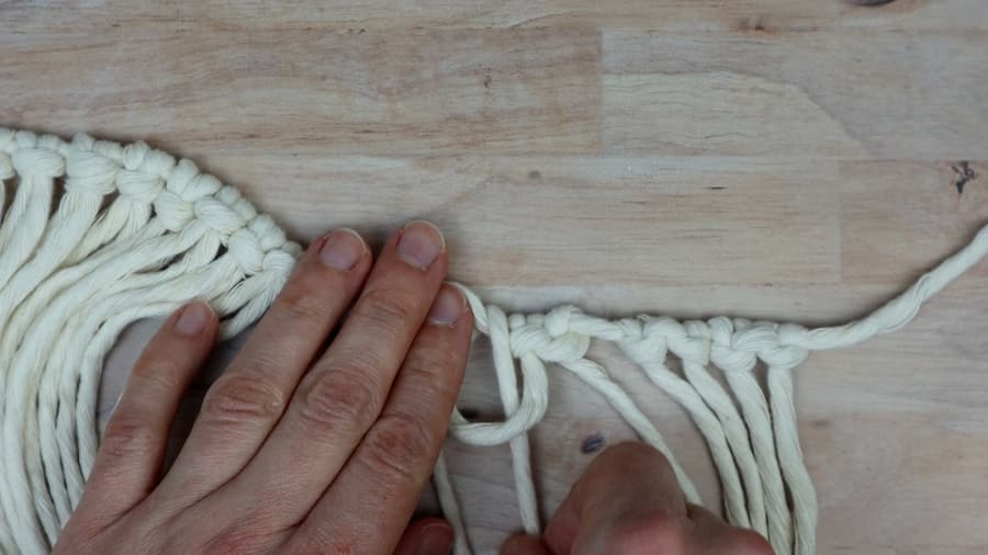 adding an extra hitch to each side of the larks head knots for DIY macrame lamp shade