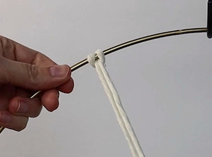 attach the cords to the metal ring with cow hitch knots