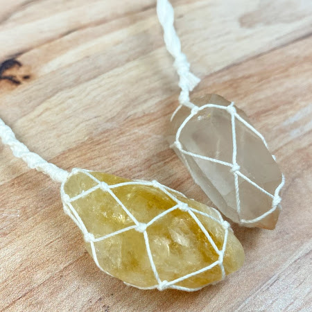 two stones wrapped in macrame