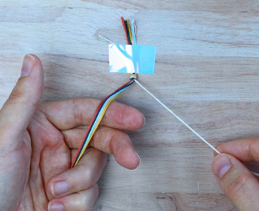 hold one cord in your right hand and the other cords in your left hand