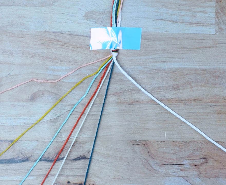 hold the thicker cord to the right and lay out the other cords on the left