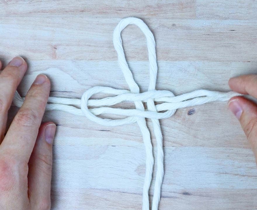 thread the ends of each piece through the loops and pull them to tighten