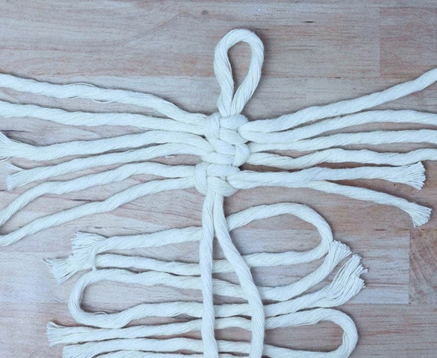 alternating square knots going down the spine of the feather