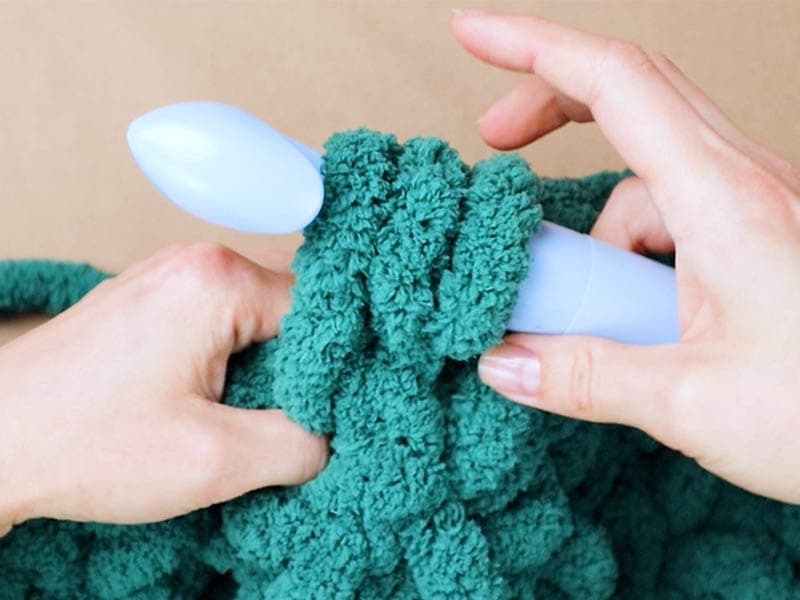 to add more yarn, complete part of the double crochet and stop when you have three loops on the hook