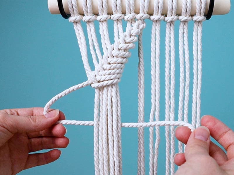 make a reverse half hitch knot around all the cords