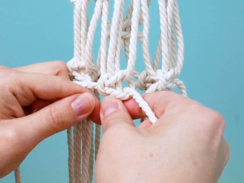 tie a row of square knots that go all the way around
