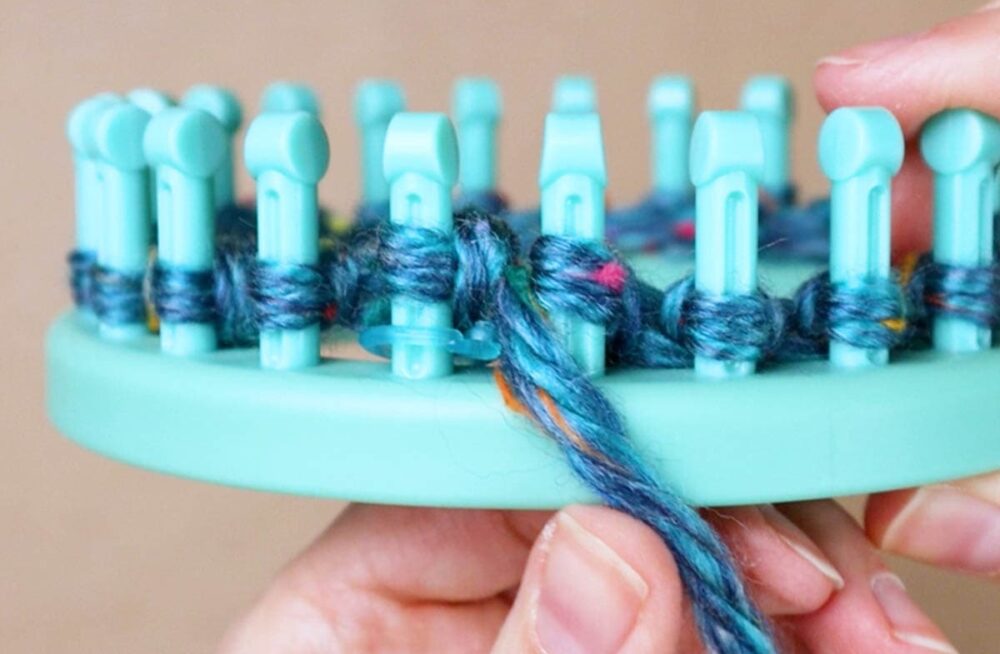 hold the yarn in front of the second loop