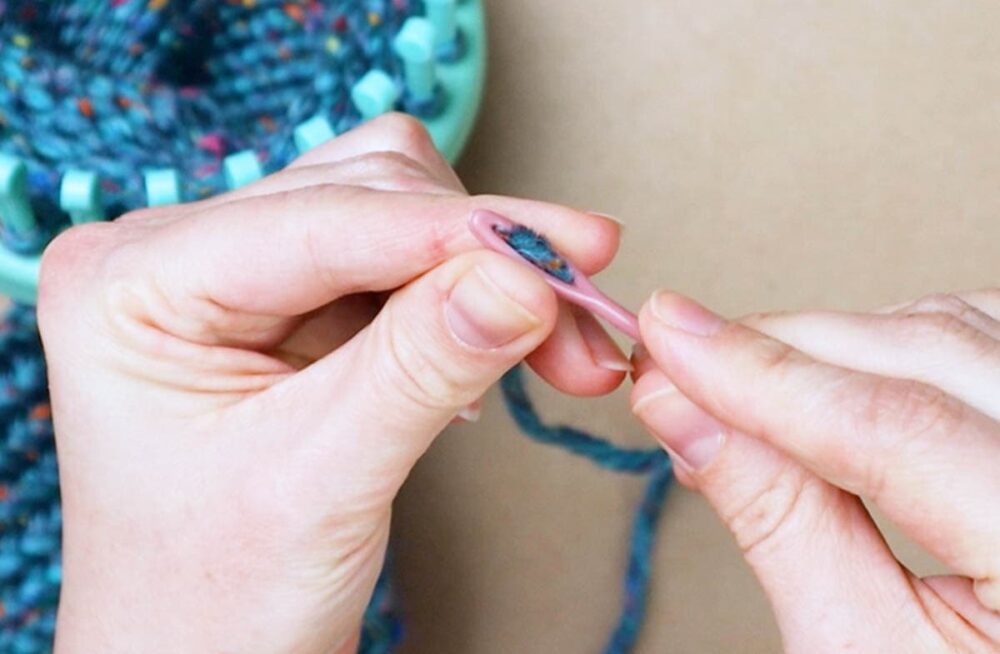 thread the yarn onto a yarn needle