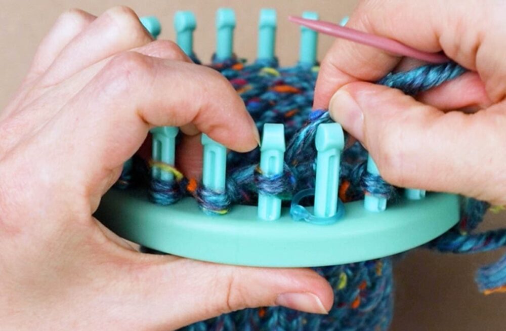 slide the loop off of peg one