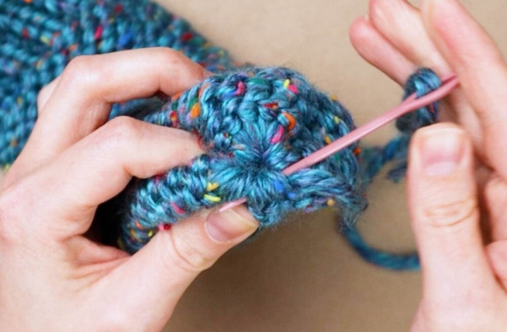 sewing around the hole of the sock