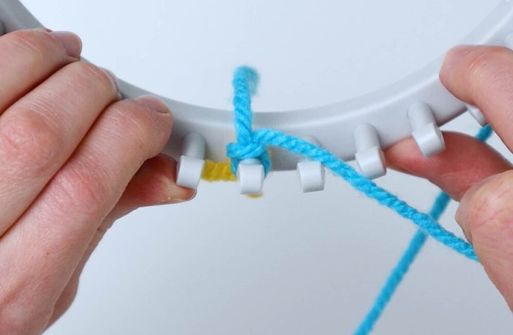 slip knot made and attached to the first peg