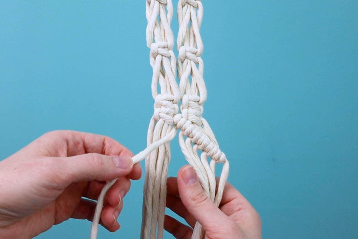 use the far right cord from the left strap as the filler cord to tie a row of double half hitch knots going down and to the right