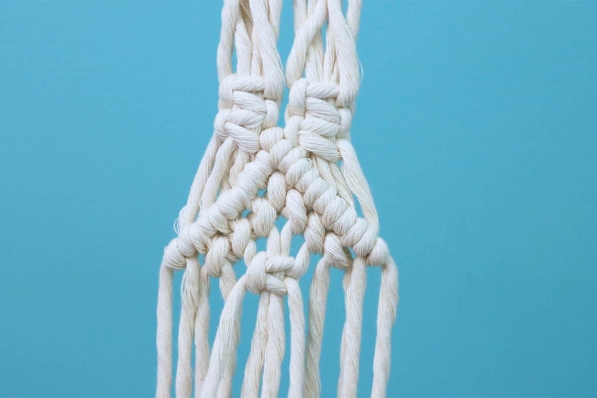 tie a square knot with the center four cords