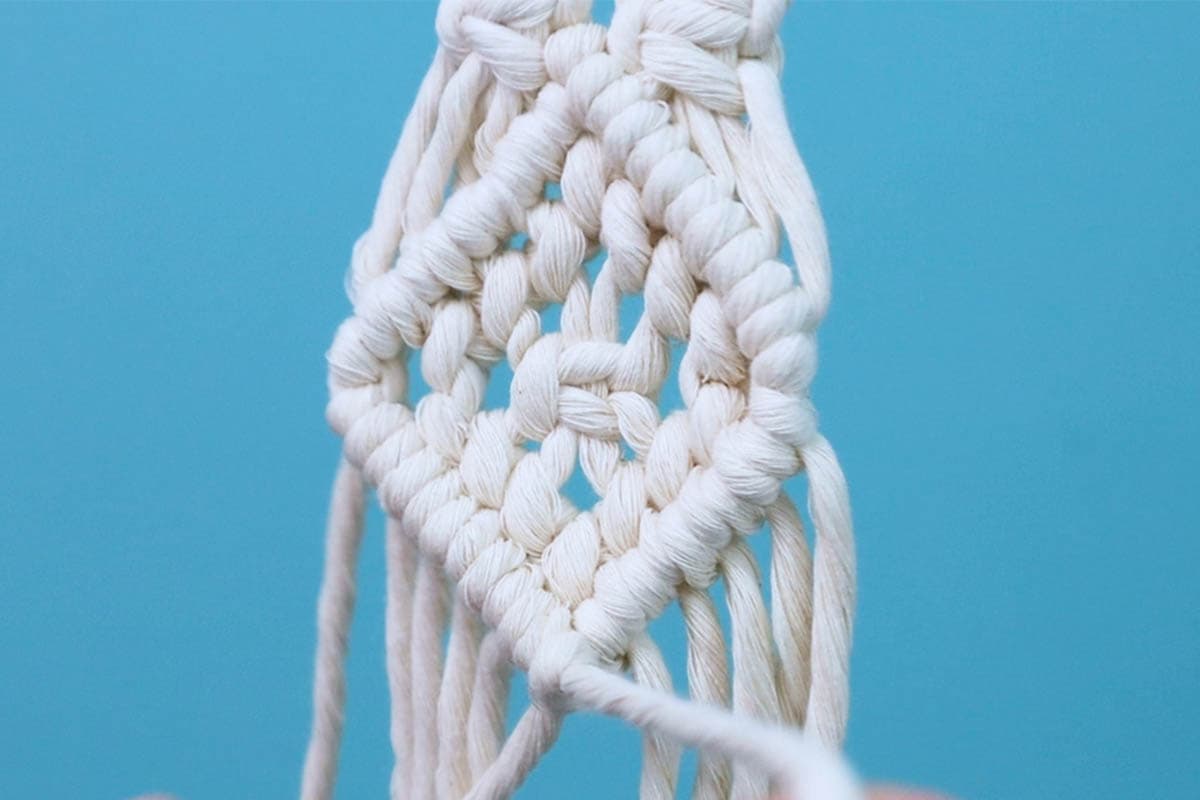 tie the double half hitch knots to finish the bottom of the diamond shape