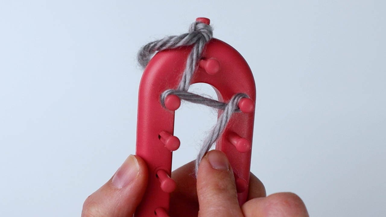 then wrap across around the second peg