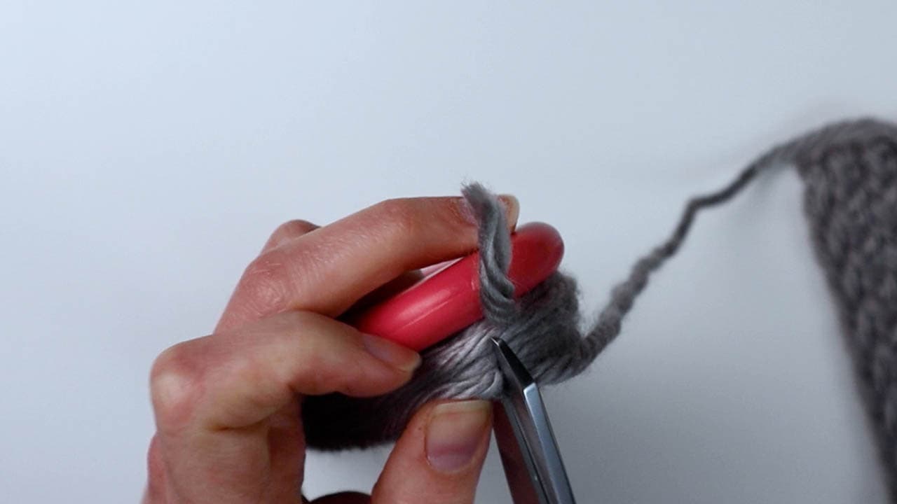 cut the bundle of fringe at the top of the loom