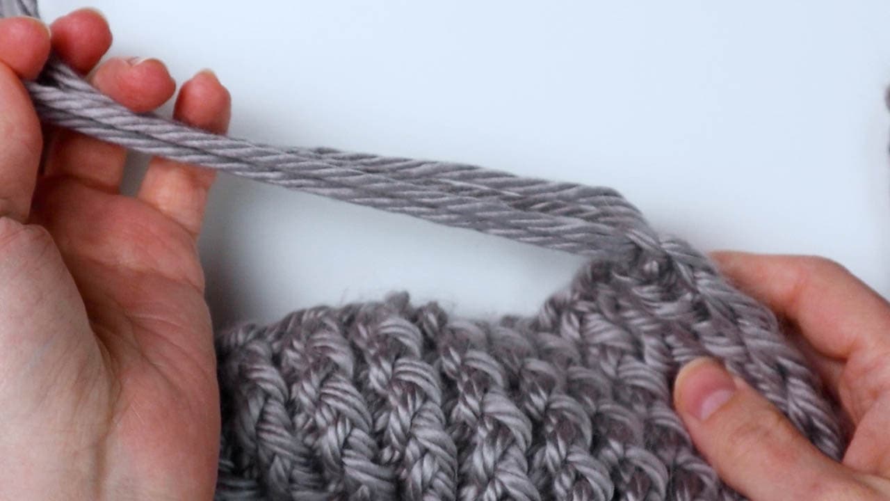 pull the ends of the pieces of fringe through