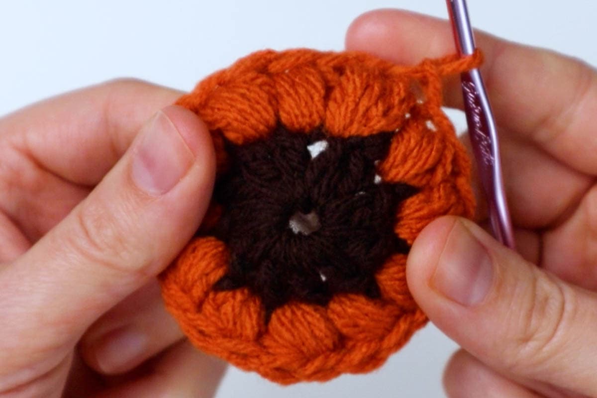 second round of sunburst granny square complete