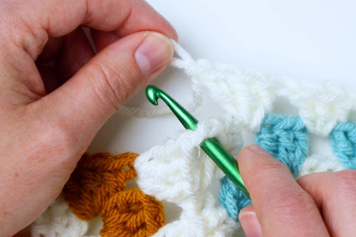 remove the loop from your hook, insert the hook into the space, put the loop back on your hook