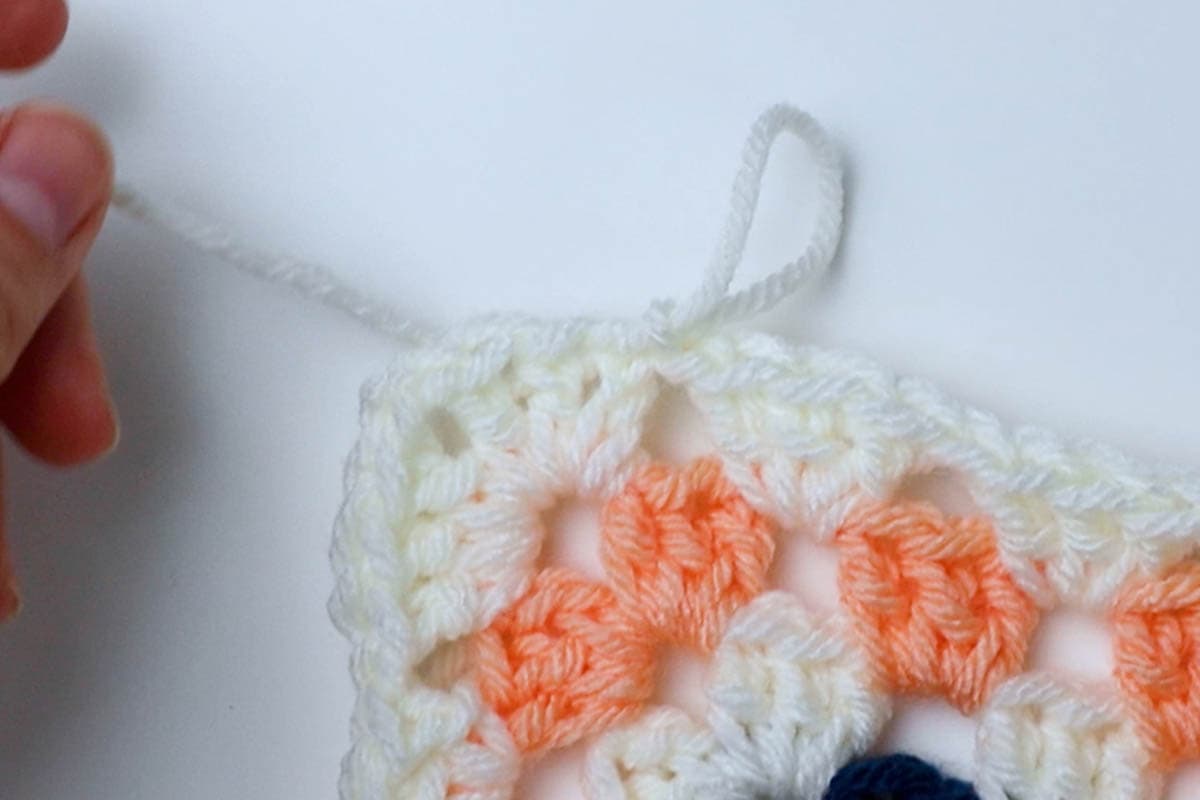 cut yarn and pull the end through the loop from your hook