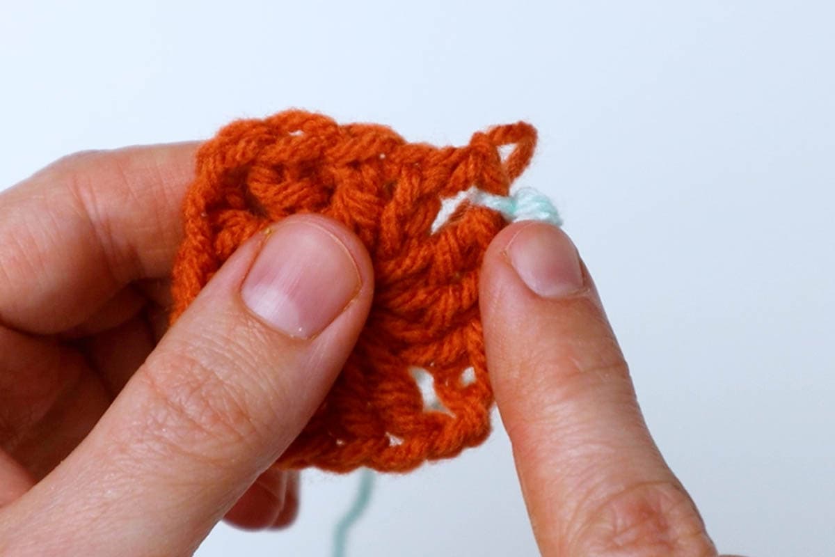 tie next color of yarn into the corner space you finished on