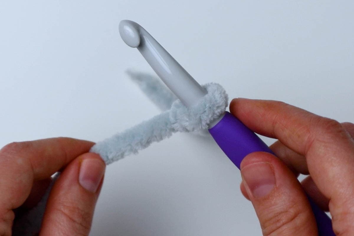 attach yarn to your hook with a slip knot