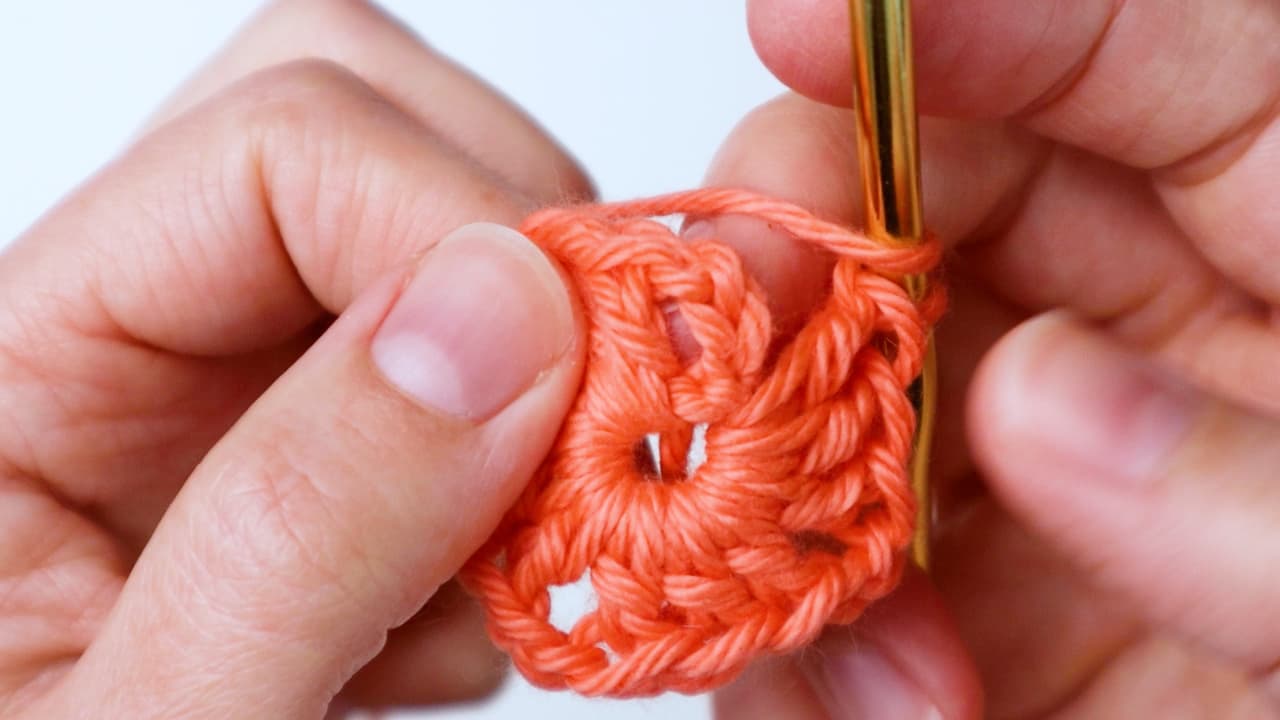 finish round by half double crocheting in top of chain 3