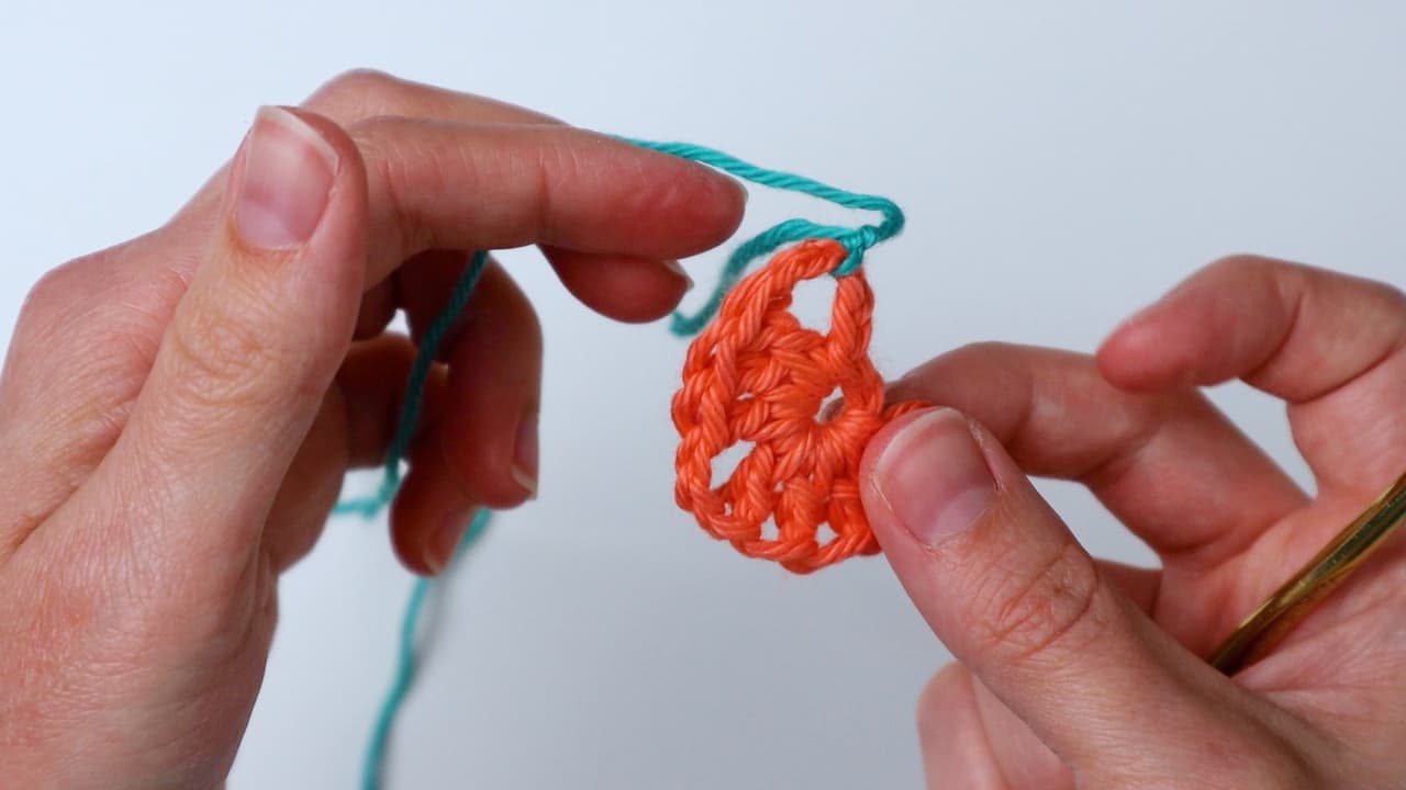 tie next color onto corner of triangle