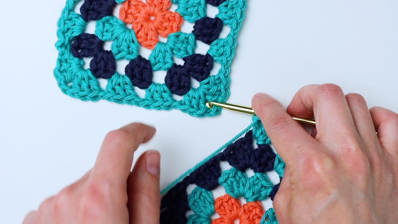 starting to attach the granny squares