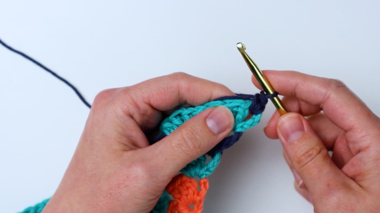 chain one and single crochet in same space with border color