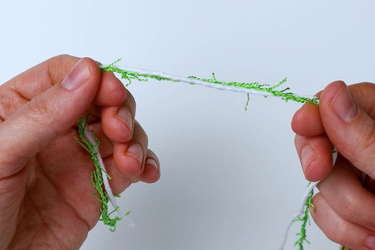 holding two strands of yarn together for this washcloth pattern
