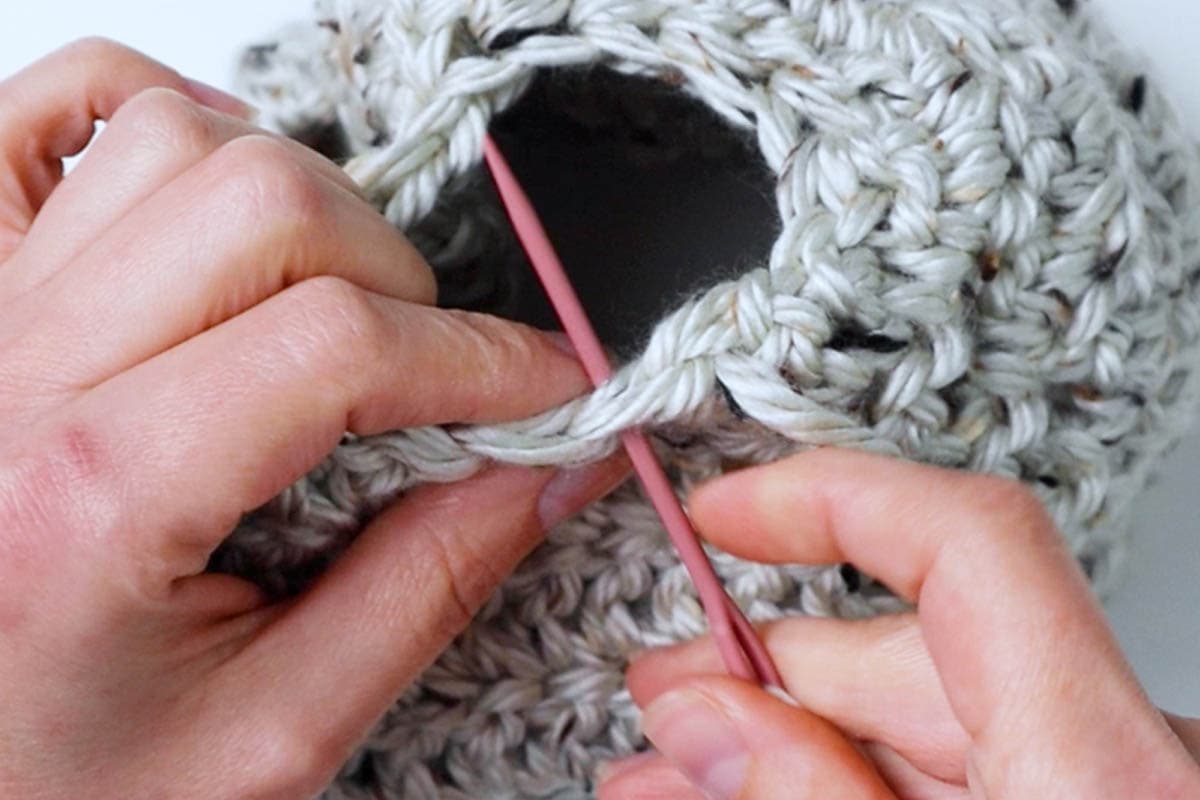 sew a running stitch to cinch up the hat hole