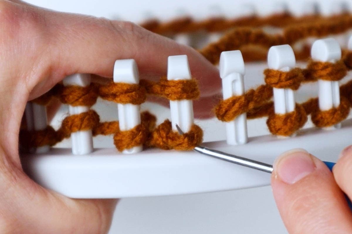 knit the bottom loop over the top loop