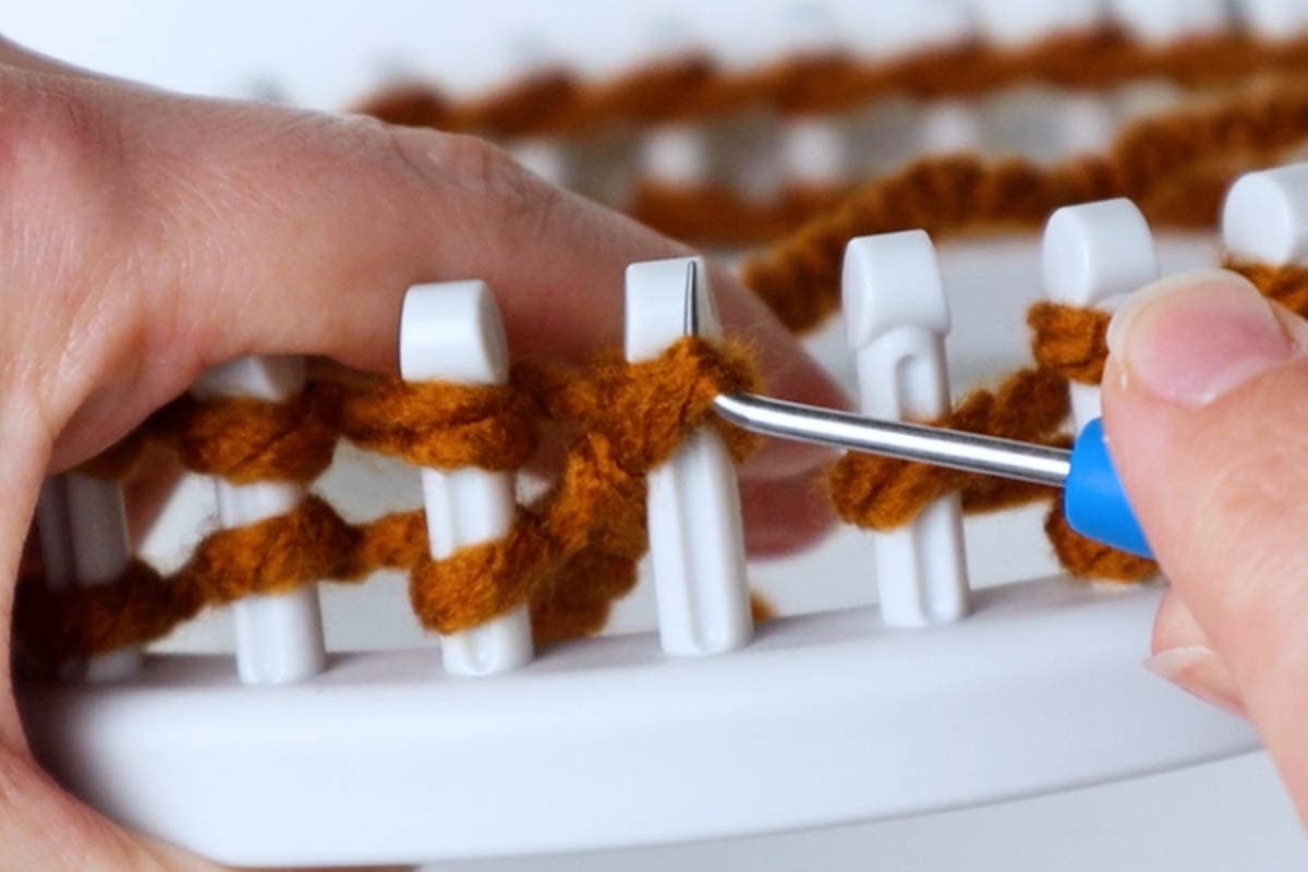 knitting the bottom loop over the top loop