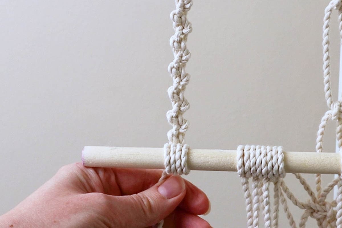 left holding strap attached to the dowel