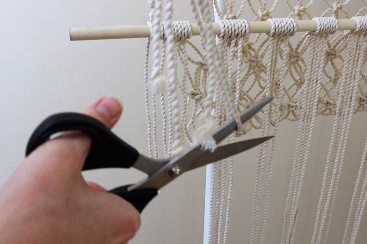 cutting the super long piece of excess cord in half